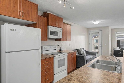 2430-700 Willowbrook Road Nw, Airdrie, AB - Indoor Photo Showing Kitchen With Double Sink