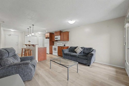 2430-700 Willowbrook Road Nw, Airdrie, AB - Indoor Photo Showing Living Room