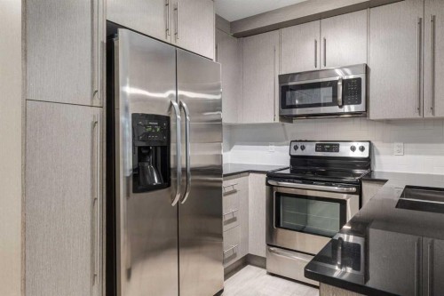 2108-11 Mahogany Row Se, Calgary, AB - Indoor Photo Showing Kitchen With Stainless Steel Kitchen