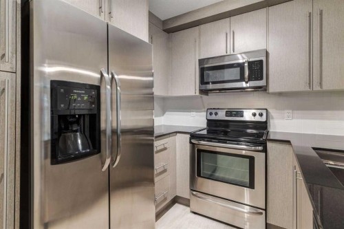 2108-11 Mahogany Row Se, Calgary, AB - Indoor Photo Showing Kitchen With Stainless Steel Kitchen