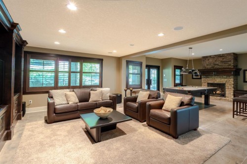116 Lynx Ridge Road Nw, Calgary, AB - Indoor Photo Showing Living Room With Fireplace