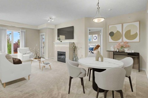 205-15 Everstone Drive Sw, Calgary, AB - Indoor Photo Showing Dining Room With Fireplace