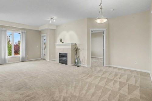 205-15 Everstone Drive Sw, Calgary, AB - Indoor With Fireplace