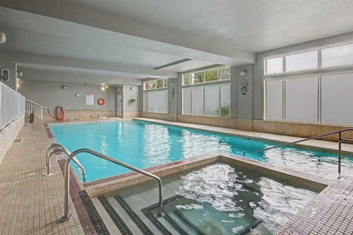 205-15 Everstone Drive Sw, Calgary, AB - Indoor Photo Showing Other Room With In Ground Pool