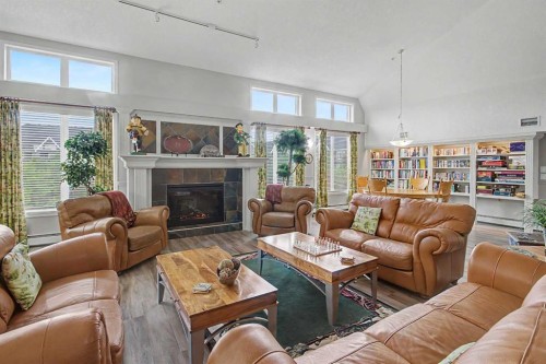 205-15 Everstone Drive Sw, Calgary, AB - Indoor Photo Showing Living Room With Fireplace