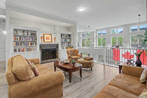 205-15 Everstone Drive Sw, Calgary, AB - Indoor Photo Showing Living Room With Fireplace