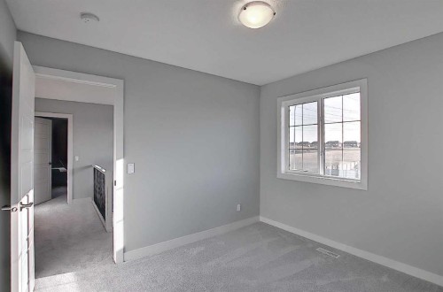 16 Topaz Place, Cochrane, AB - Indoor Photo Showing Other Room