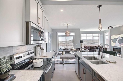16 Topaz Place, Cochrane, AB - Indoor Photo Showing Kitchen With Double Sink With Upgraded Kitchen
