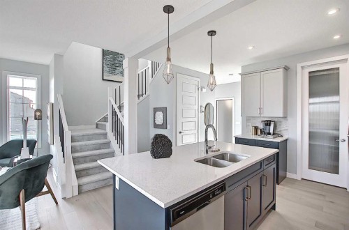 16 Topaz Place, Cochrane, AB - Indoor Photo Showing Kitchen With Double Sink With Upgraded Kitchen