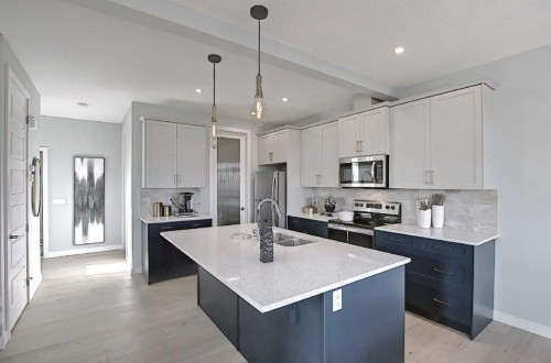 16 Topaz Place, Cochrane, AB - Indoor Photo Showing Kitchen With Upgraded Kitchen