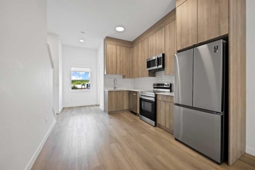 209-101 Panatella Square Nw, Calgary, AB - Indoor Photo Showing Kitchen