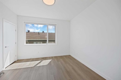 209-101 Panatella Square Nw, Calgary, AB - Indoor Photo Showing Other Room