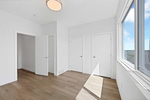 209-101 Panatella Square Nw, Calgary, AB - Indoor Photo Showing Other Room