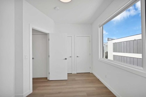 209-101 Panatella Square Nw, Calgary, AB - Indoor Photo Showing Other Room
