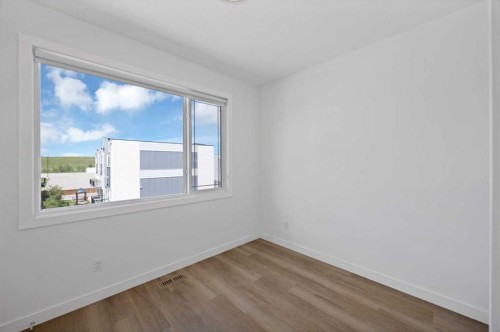 209-101 Panatella Square Nw, Calgary, AB - Indoor Photo Showing Other Room