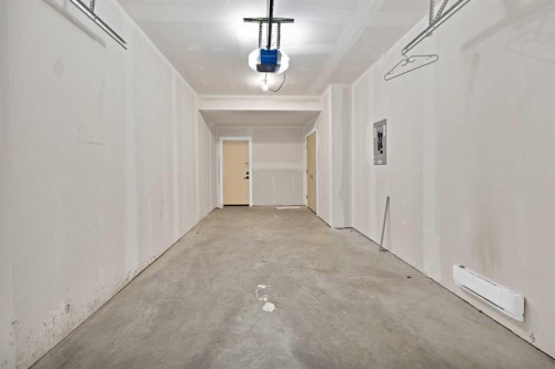 209-101 Panatella Square Nw, Calgary, AB - Indoor Photo Showing Other Room