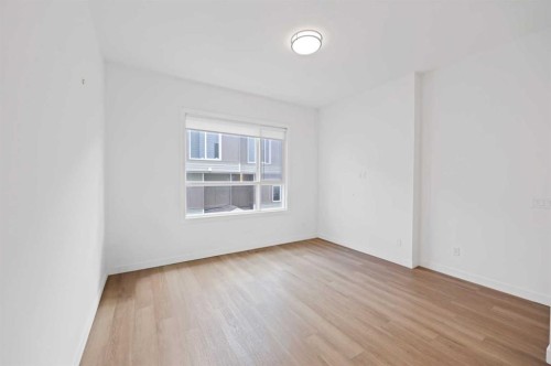 209-101 Panatella Square Nw, Calgary, AB - Indoor Photo Showing Other Room