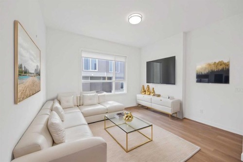 209-101 Panatella Square Nw, Calgary, AB - Indoor Photo Showing Living Room