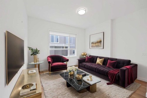 209-101 Panatella Square Nw, Calgary, AB - Indoor Photo Showing Living Room