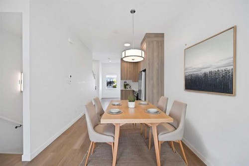 209-101 Panatella Square Nw, Calgary, AB - Indoor Photo Showing Dining Room