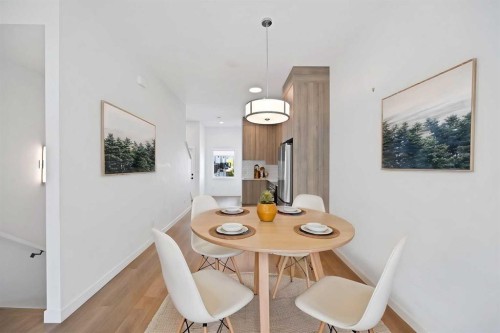 209-101 Panatella Square Nw, Calgary, AB - Indoor Photo Showing Dining Room