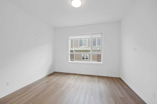 209-101 Panatella Square Nw, Calgary, AB - Indoor Photo Showing Other Room