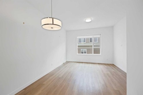 209-101 Panatella Square Nw, Calgary, AB - Indoor Photo Showing Other Room