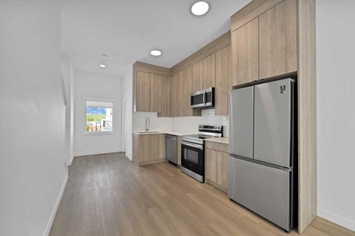209-101 Panatella Square Nw, Calgary, AB - Indoor Photo Showing Kitchen