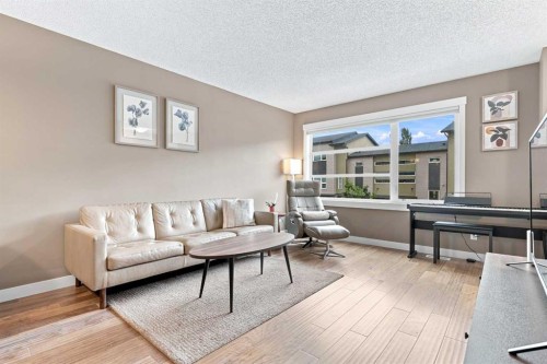 231 Covecreek Circle Ne, Calgary, AB - Indoor Photo Showing Living Room