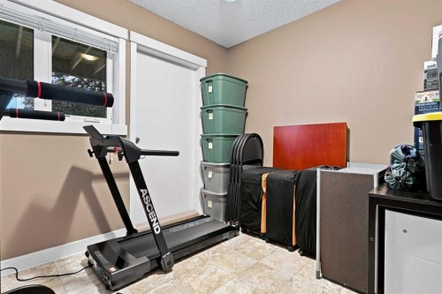 231 Covecreek Circle Ne, Calgary, AB - Indoor Photo Showing Gym Room