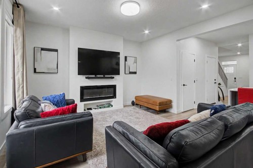 67 Copperhead Grove Se, Calgary, AB - Indoor Photo Showing Living Room With Fireplace