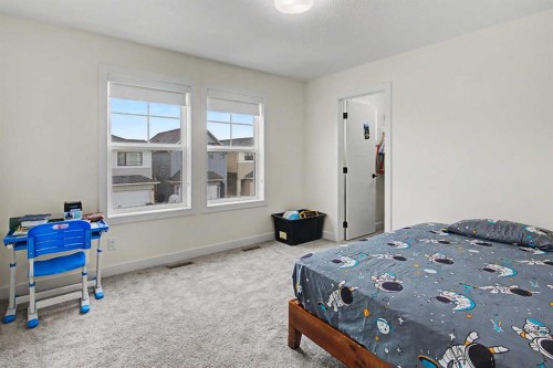 67 Copperhead Grove Se, Calgary, AB - Indoor Photo Showing Bedroom