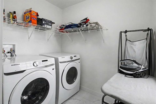 67 Copperhead Grove Se, Calgary, AB - Indoor Photo Showing Laundry Room