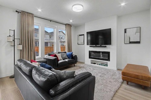 67 Copperhead Grove Se, Calgary, AB - Indoor Photo Showing Living Room With Fireplace