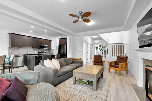 122 Windridge Road Sw, Airdrie, AB - Indoor Photo Showing Living Room With Fireplace