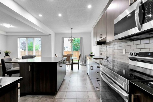 122 Windridge Road Sw, Airdrie, AB - Indoor Photo Showing Kitchen With Upgraded Kitchen