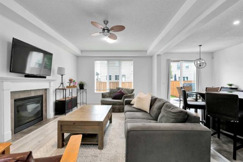 122 Windridge Road Sw, Airdrie, AB - Indoor Photo Showing Living Room With Fireplace