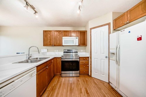 30 Covehaven View Ne, Calgary, AB - Indoor Photo Showing Kitchen With Double Sink