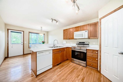 30 Covehaven View Ne, Calgary, AB - Indoor Photo Showing Kitchen With Double Sink