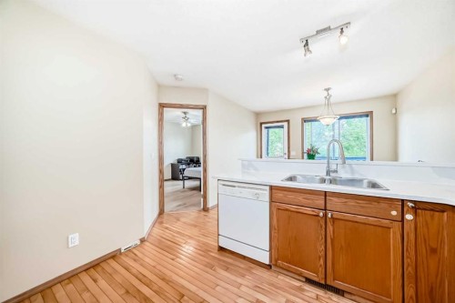 30 Covehaven View Ne, Calgary, AB - Indoor Photo Showing Kitchen With Double Sink