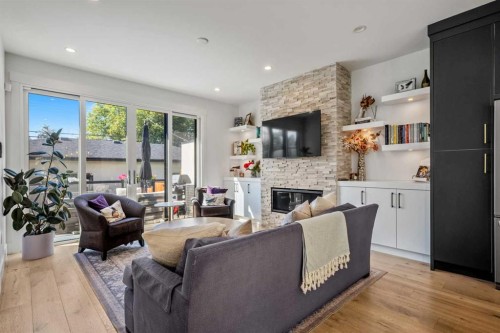 2213 25 Avenue Nw, Calgary, AB - Indoor Photo Showing Living Room With Fireplace