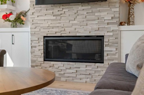 2213 25 Avenue Nw, Calgary, AB - Indoor Photo Showing Living Room With Fireplace