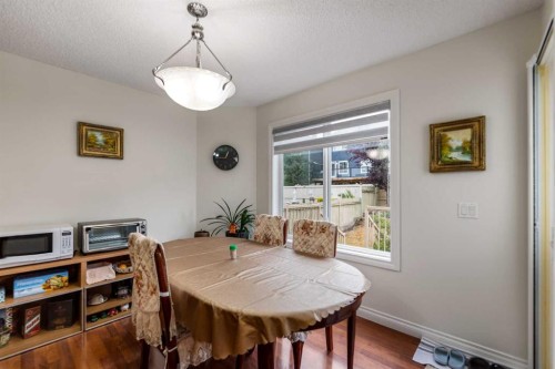 10 Evansmeade Manor Nw, Calgary, AB - Indoor Photo Showing Dining Room