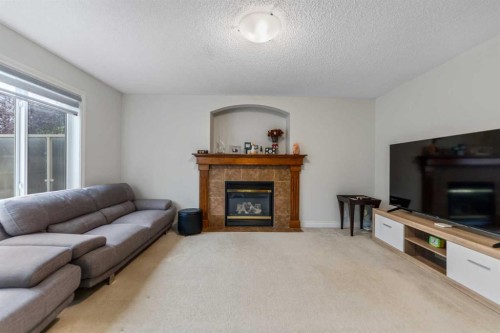 10 Evansmeade Manor Nw, Calgary, AB - Indoor Photo Showing Living Room With Fireplace