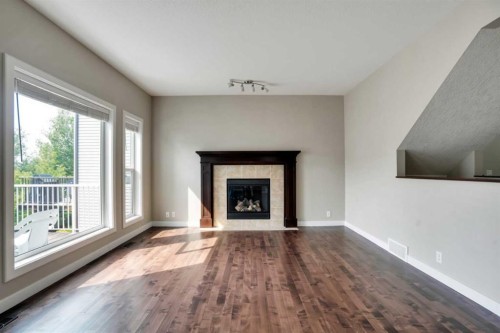 92 Everglen Close Sw, Calgary, AB - Indoor Photo Showing Living Room With Fireplace