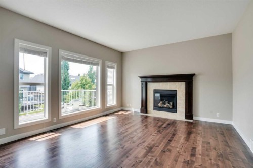 92 Everglen Close Sw, Calgary, AB - Indoor Photo Showing Living Room With Fireplace
