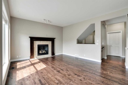 92 Everglen Close Sw, Calgary, AB - Indoor Photo Showing Living Room With Fireplace