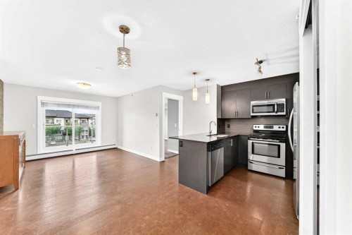 1411-240 Skyview Ranch Road Ne, Calgary, AB - Indoor Photo Showing Kitchen With Stainless Steel Kitchen