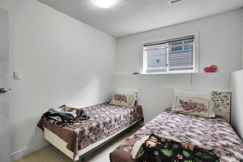 28 Martinridge Road Ne, Calgary, AB - Indoor Photo Showing Bedroom