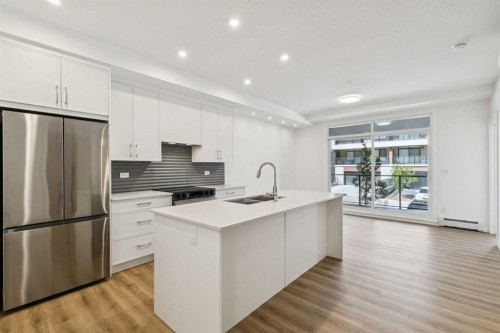 6107-1808 Mahogany Boulevard Se, Calgary, AB - Indoor Photo Showing Kitchen With Double Sink With Upgraded Kitchen